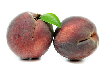 Image showing Peach with leaf isolated on white