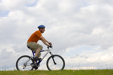 Image showing Man riding a mountain bike