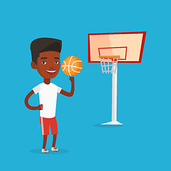 Image showing Young basketball player spinning ball.