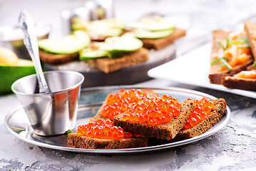 Image showing bread with red salmon caviar 