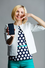 Image showing Woman with smartphone in hand