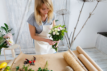 Image showing Young florist in flower shop