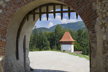 Image showing Old gate in a stone fortress wall