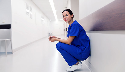 Image showing happy doctor or nurse at hospital corridor