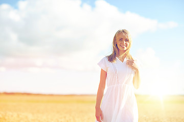 Image showing happy young woman or teenage girl on cereal field