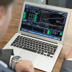 Image showing Young businessman working with laptop, man\'s hands on notebook computer.