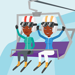 Image showing Two happy skiers using cableway at ski resort.