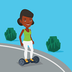 Image showing Woman riding on self-balancing electric scooter.