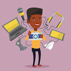 Image showing Young man surrounded with his gadgets.