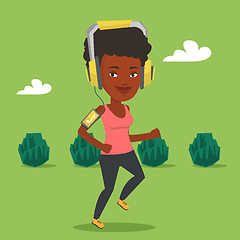 Image showing Woman running with earphones and smartphone.