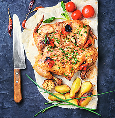 Image showing Baked chicken with potatoes on pita