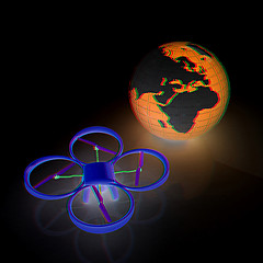 Image showing Quadrocopter Drone with Earth Globe and remote controller on a w