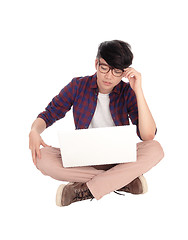 Image showing Young Asian teen with laptop.