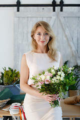 Image showing Portrait of woman with bouquet