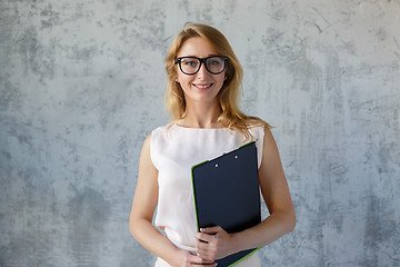 Image showing Long-haired beautiful woman in glasses