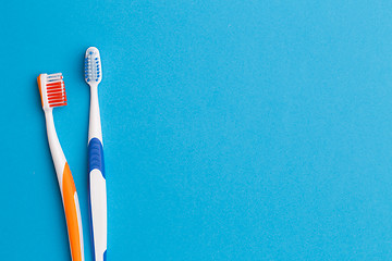 Image showing Two toothbrushes , space for text