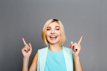 Image showing Happy woman showing thumbs up