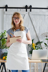 Image showing Portrait of young woman florist