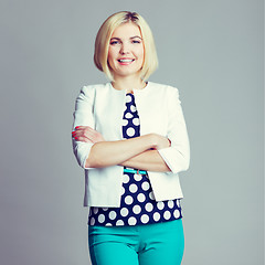 Image showing Smiling girl with arms crossed