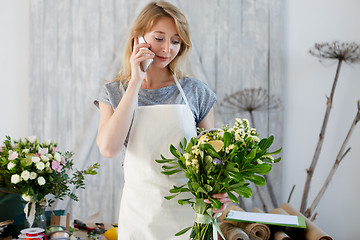 Image showing Florist woman talking on phone