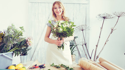 Image showing Florist girl at flower shop