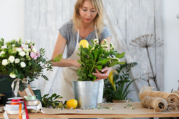 Image showing Florist with bouquet of flowers