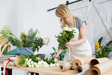 Image showing Photo of blonde making bouquet