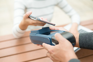 Image showing Paying with smartphone on pos terminal