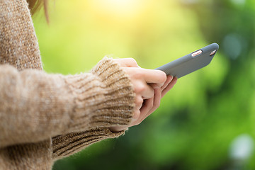 Image showing Woman use of cellphone in park