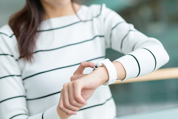 Image showing Young woman use of smart watch