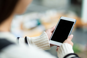 Image showing Woman holding the blank screen of cellphone