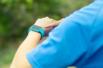 Image showing Man using smart watch