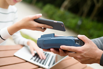 Image showing Woman pay on pos machine