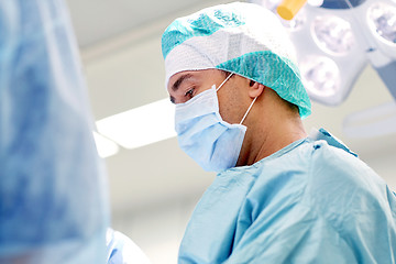 Image showing group of surgeons in operating room at hospital