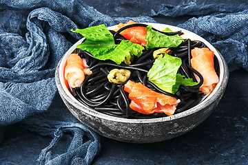 Image showing black pasta with mussels and trout