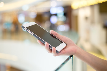 Image showing Woman holding on cellphone