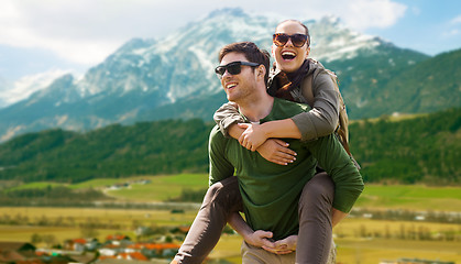 Image showing happy couple with backpacks traveling in highlands