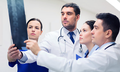 Image showing group of medics with spine x-ray scan at hospital