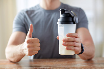 Image showing man with protein food showing thumbs up