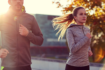 Image showing couple running outdoors
