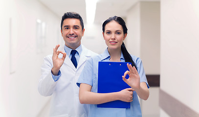 Image showing doctor and nurse showing ok sign at hospital