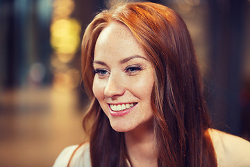 Image showing smiling happy young redhead woman face