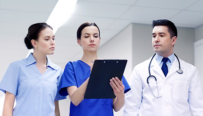 Image showing group of medics at hospital with clipboard