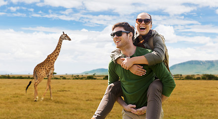 Image showing smiling couple with backpacks traveling in africa