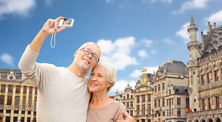 Image showing senior couple with camera traveling in brussels