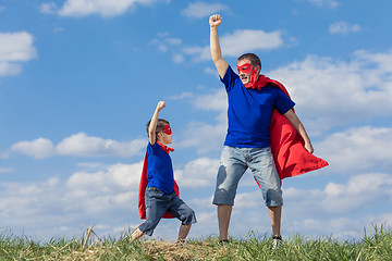 Image showing Father and son playing superhero at the day time.