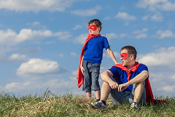 Image showing Father and son playing superhero at the day time.