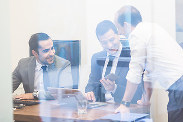 Image showing Cheerful relaxed corporate businessteam working in modern office.