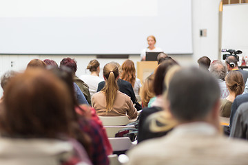 Image showing Woman giving presentation in lecture hall at university.