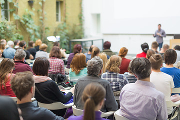 Image showing Man giving presentation in lecture hall at university.